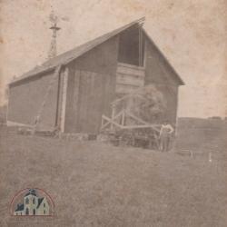 Black and white photograph of Peder Berge barn and wagon