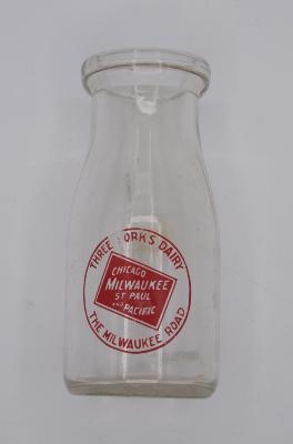 Milwaukee Road branded miniature milk bottle