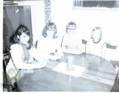 Marisol holds a round table discussion with the Fingerson children