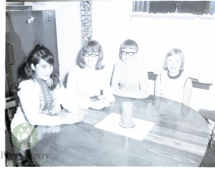 Marisol holds a round table discussion with the Fingerson children