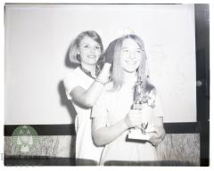 Dairy Princess Nancy Mrnak receives crown from Helen Hippe