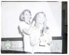 Dairy Princess Nancy Mrnak receives crown from Helen Hippe