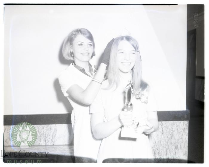 Dairy Princess Nancy Mrnak receives crown from Helen Hippe