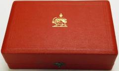 Red case with Imperial Emblem of Iran stamped in gold on the top, 1971