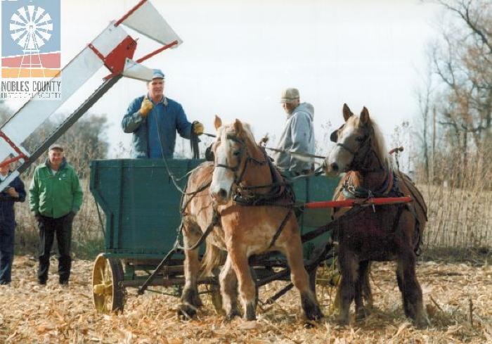 Wagon pulled by horses.