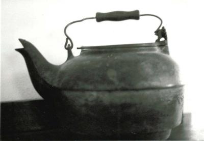black wooden handled kettle