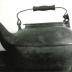black wooden handled kettle