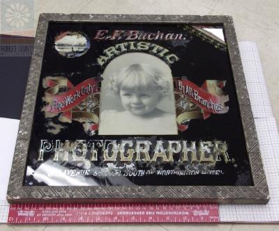 Framed advertisement for E. F. Buchan Artistic Photographer