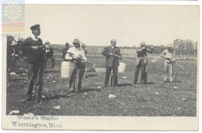 Men Shooting Guns - Worthington