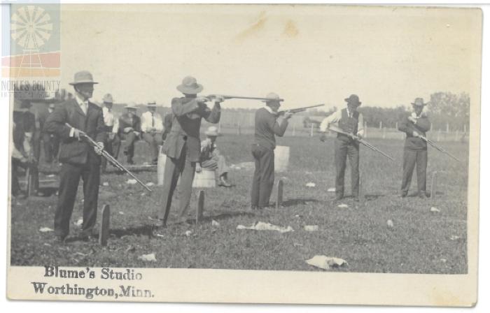 Men Shooting Guns - Worthington